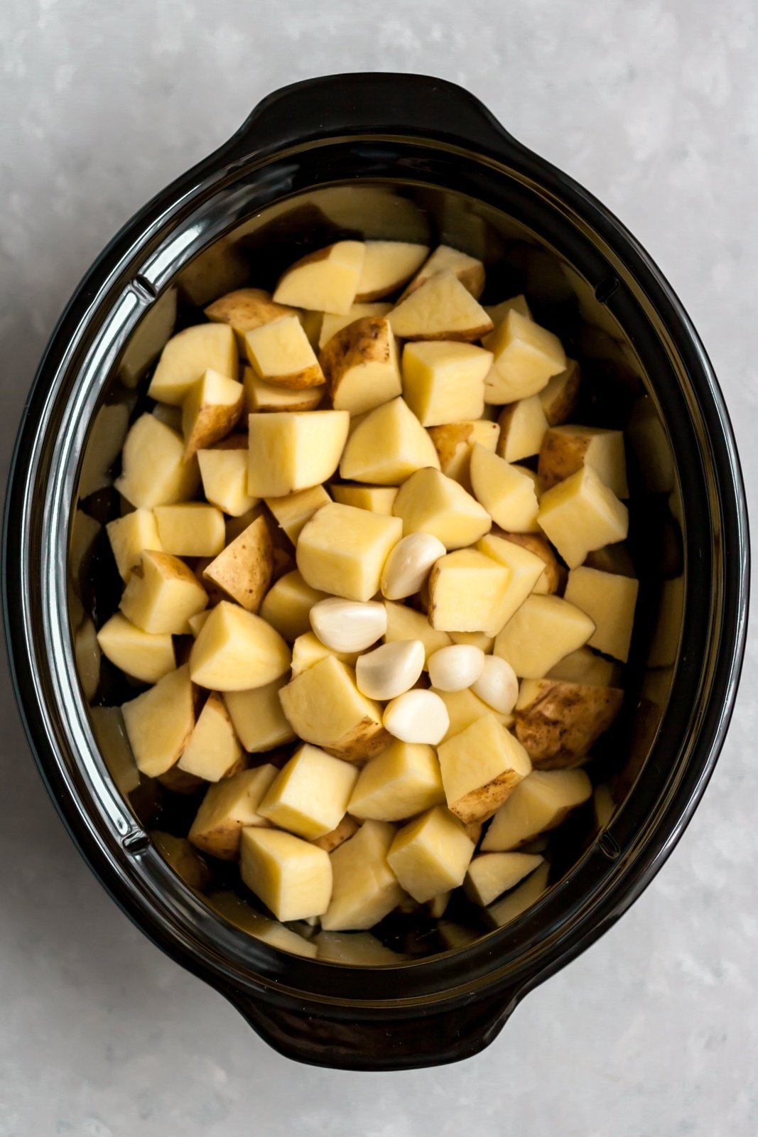potatoes and garlic in a crock pot