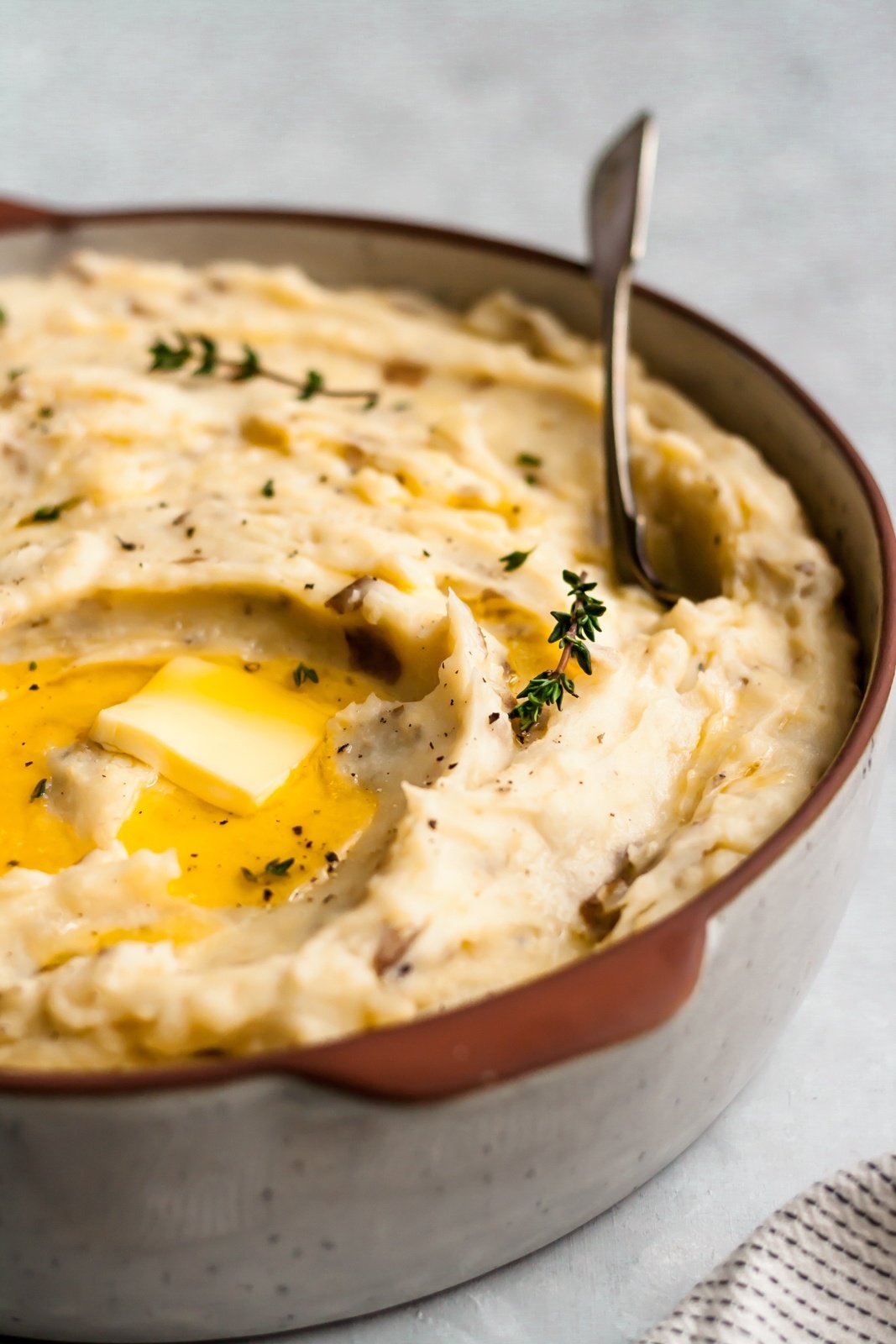 easy slow cooker mashed potatoes with butter in a bowl with a spoon