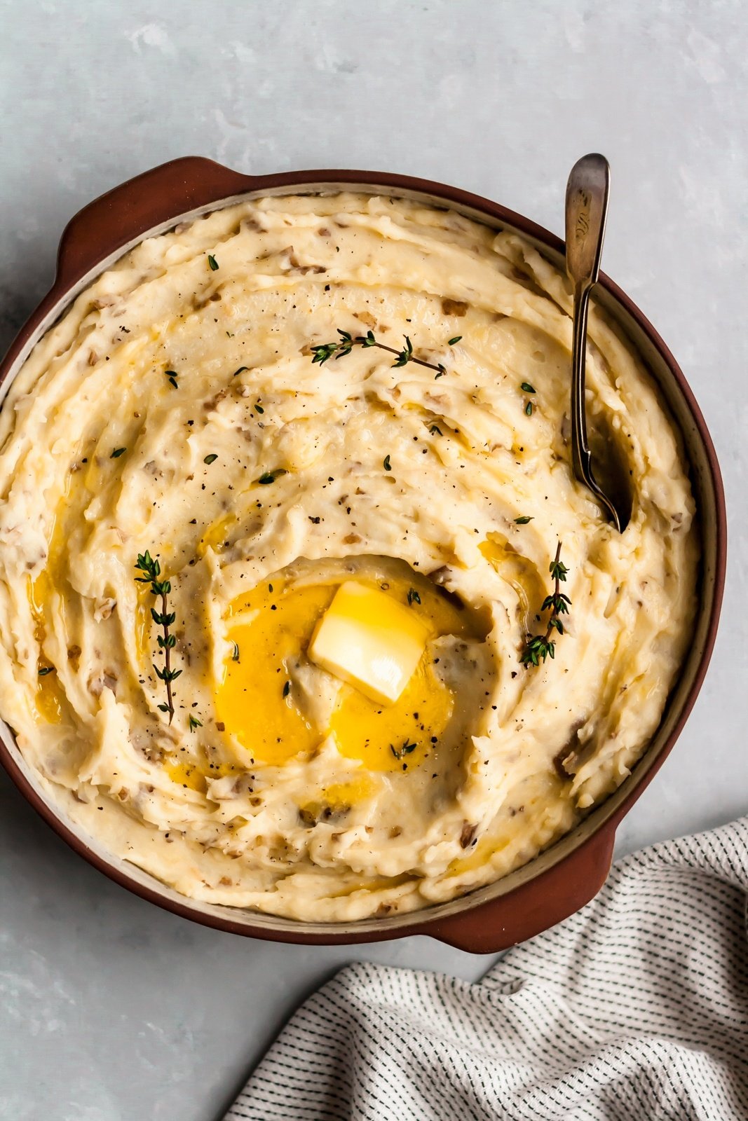 slow cooker mashed potatoes with butter in a bowl
