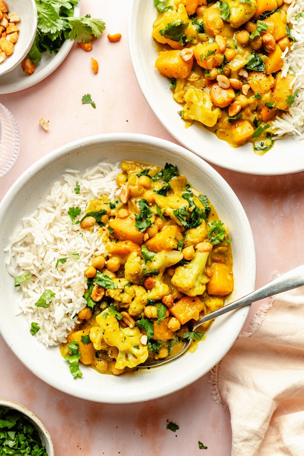 butternut squash curry in bowls with rice