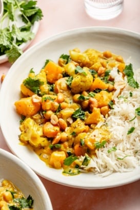 butternut squash curry in a bowl with rice