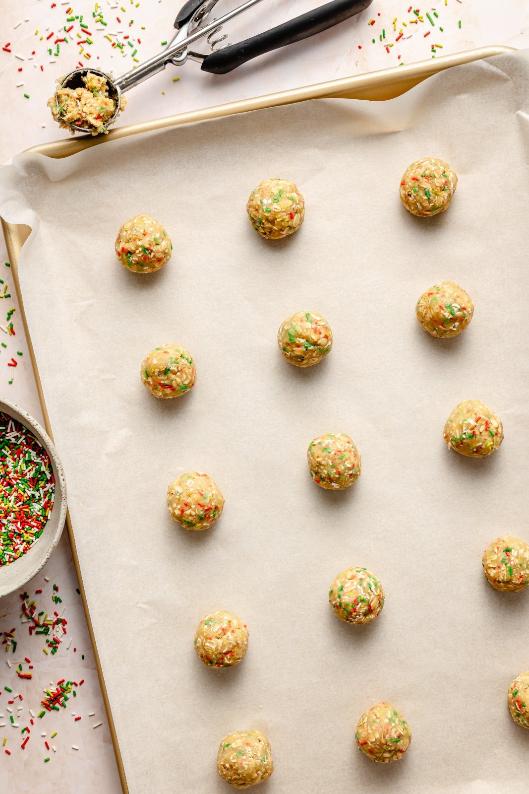 unbaked christmas sandwich cookies on a baking sheet