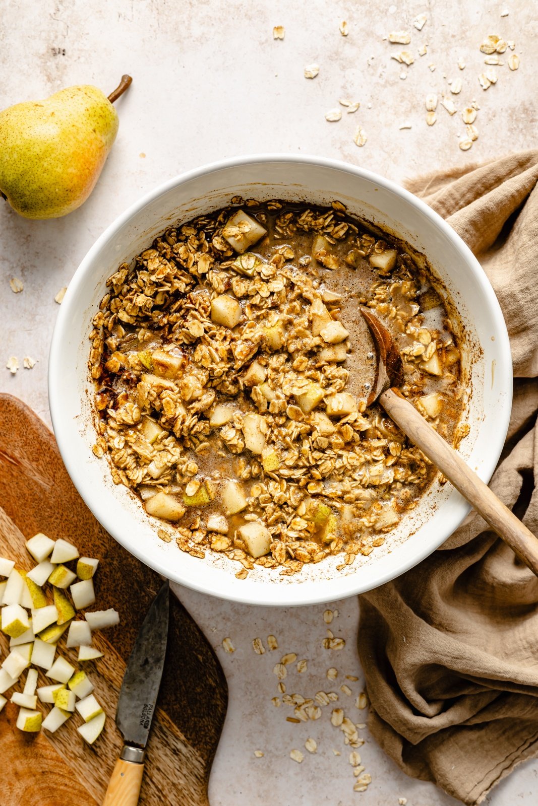 mixing batter for gingerbread baked oatmeal cups