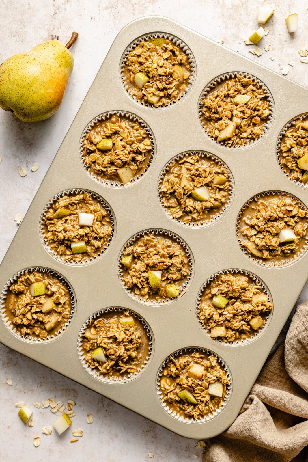 unbaked gingerbread oatmeal cups in a muffin tin