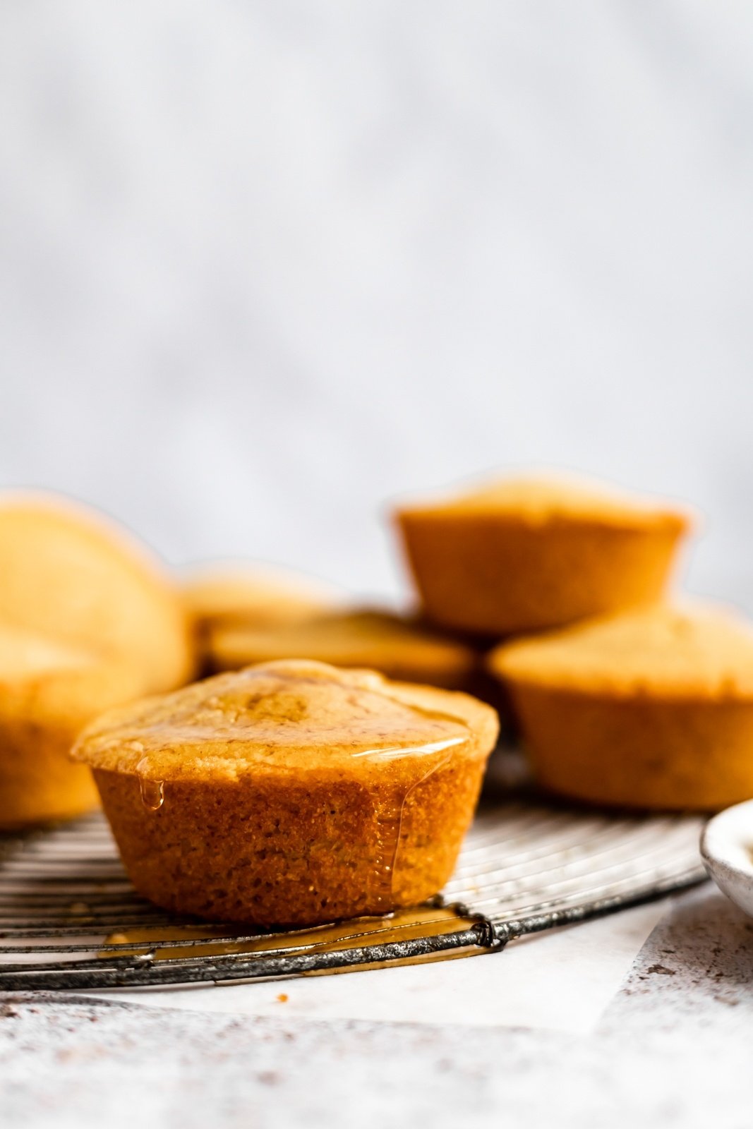 gluten free cornbread muffin drizzled with honey