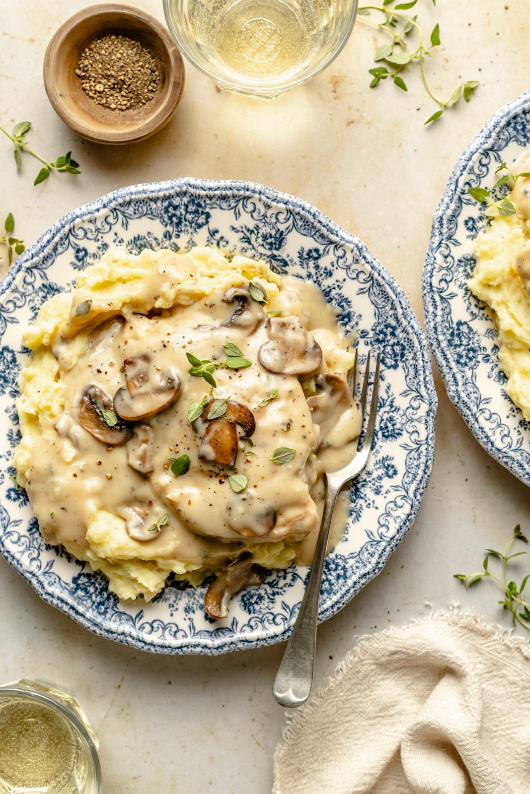 skillet chicken with mushroom gravy over mashed potatoes