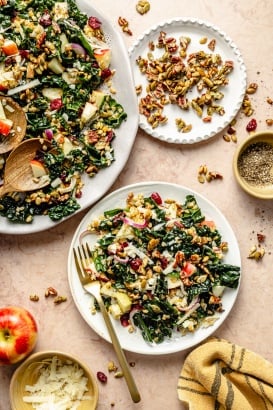 kale apple farro salad on a platter and a plate