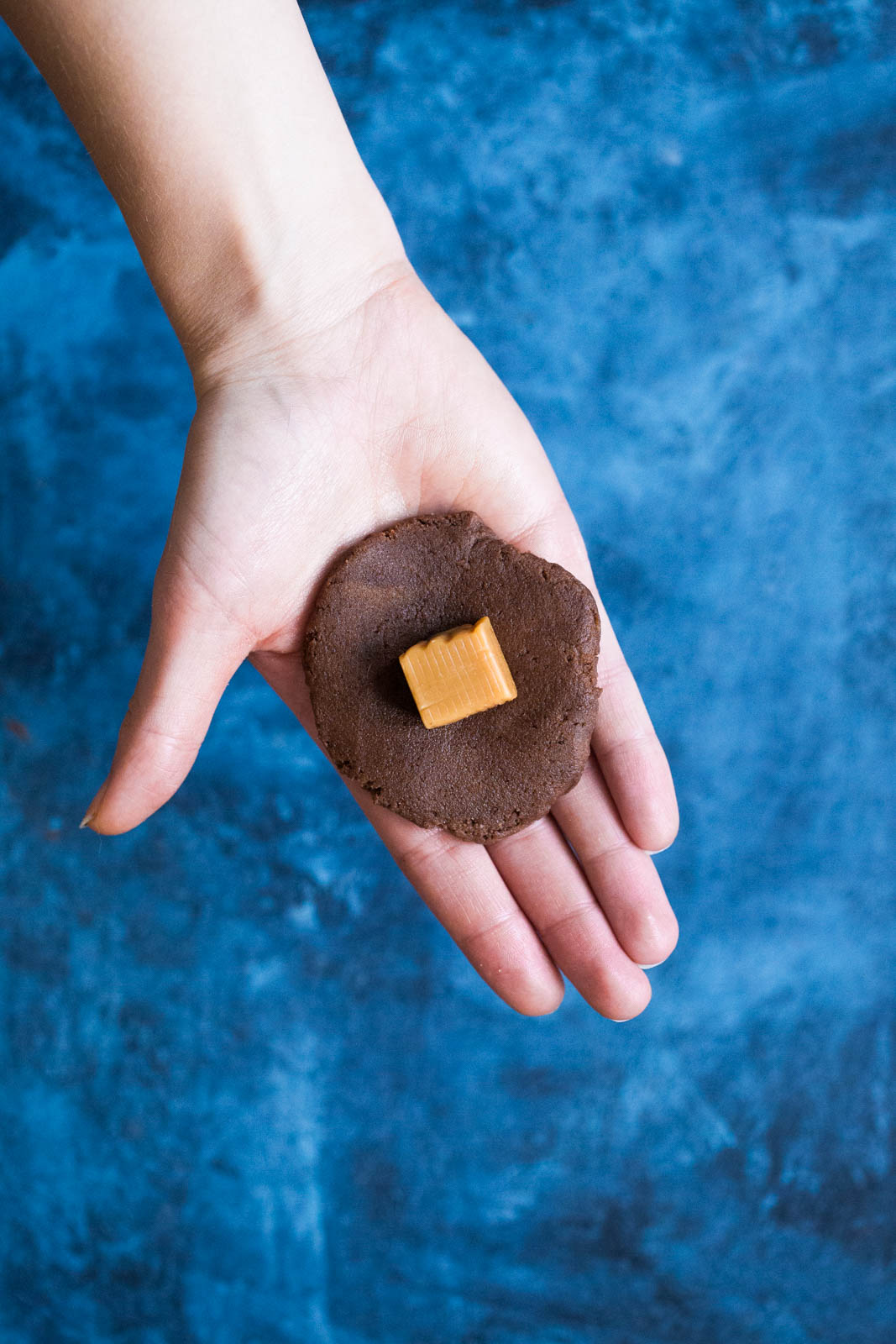 a caramel on top of chocolate snickerdoodle dough