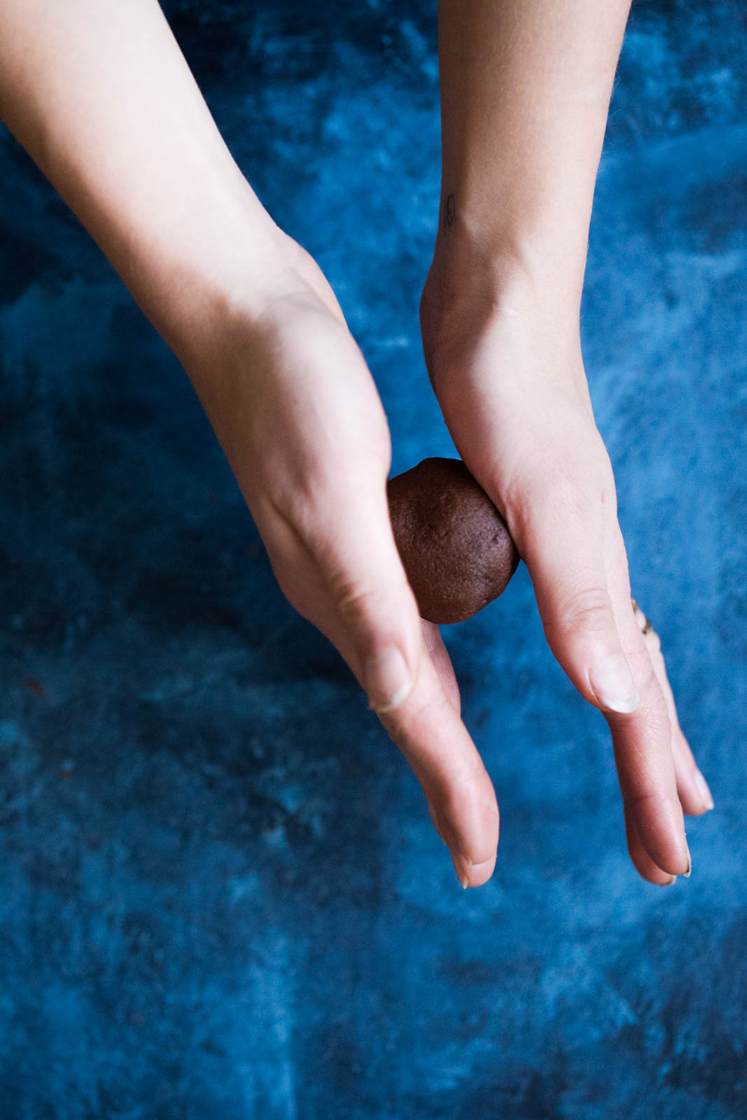 rolling a dough ball for chocolate snickerdoodles