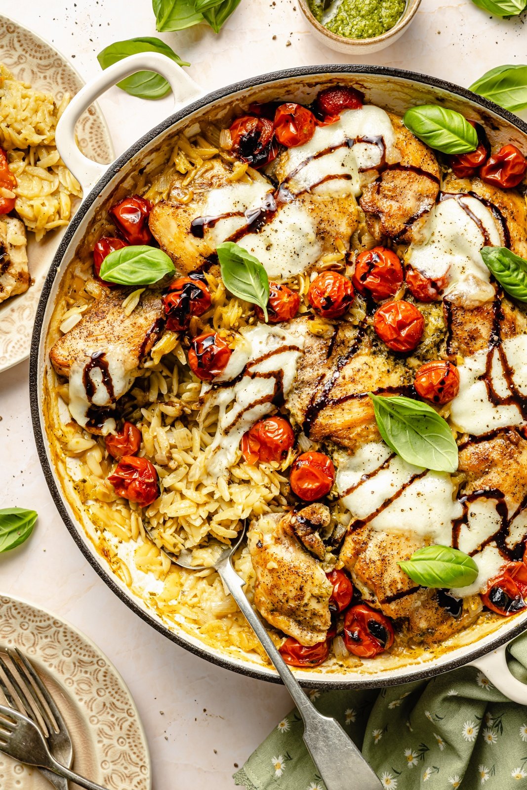 chicken caprese orzo bake in a pan