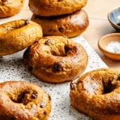 high protein pumpkin bagels on a marble board