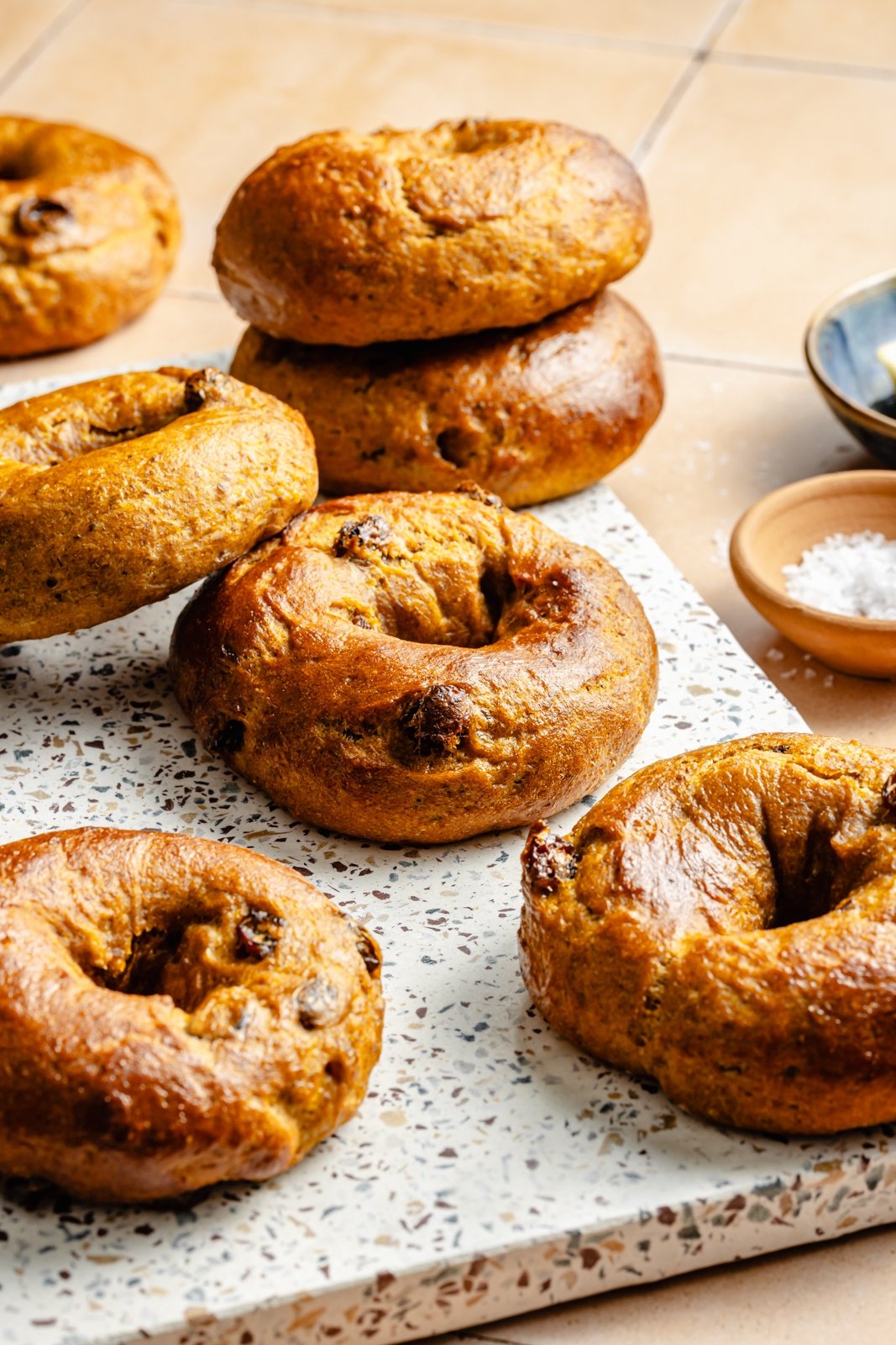 pumpkin protein bagels on a marble board