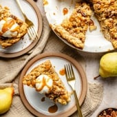 caramel pear pie in a pie dish and on plates with ice cream