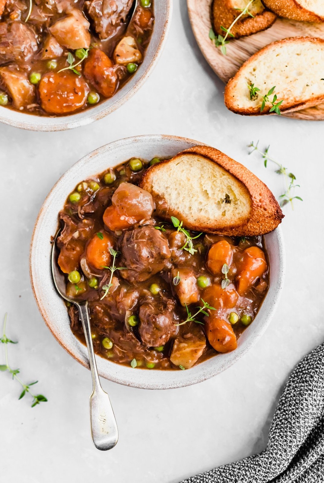 the best ever slow cooker beef stew in a bowl with bread