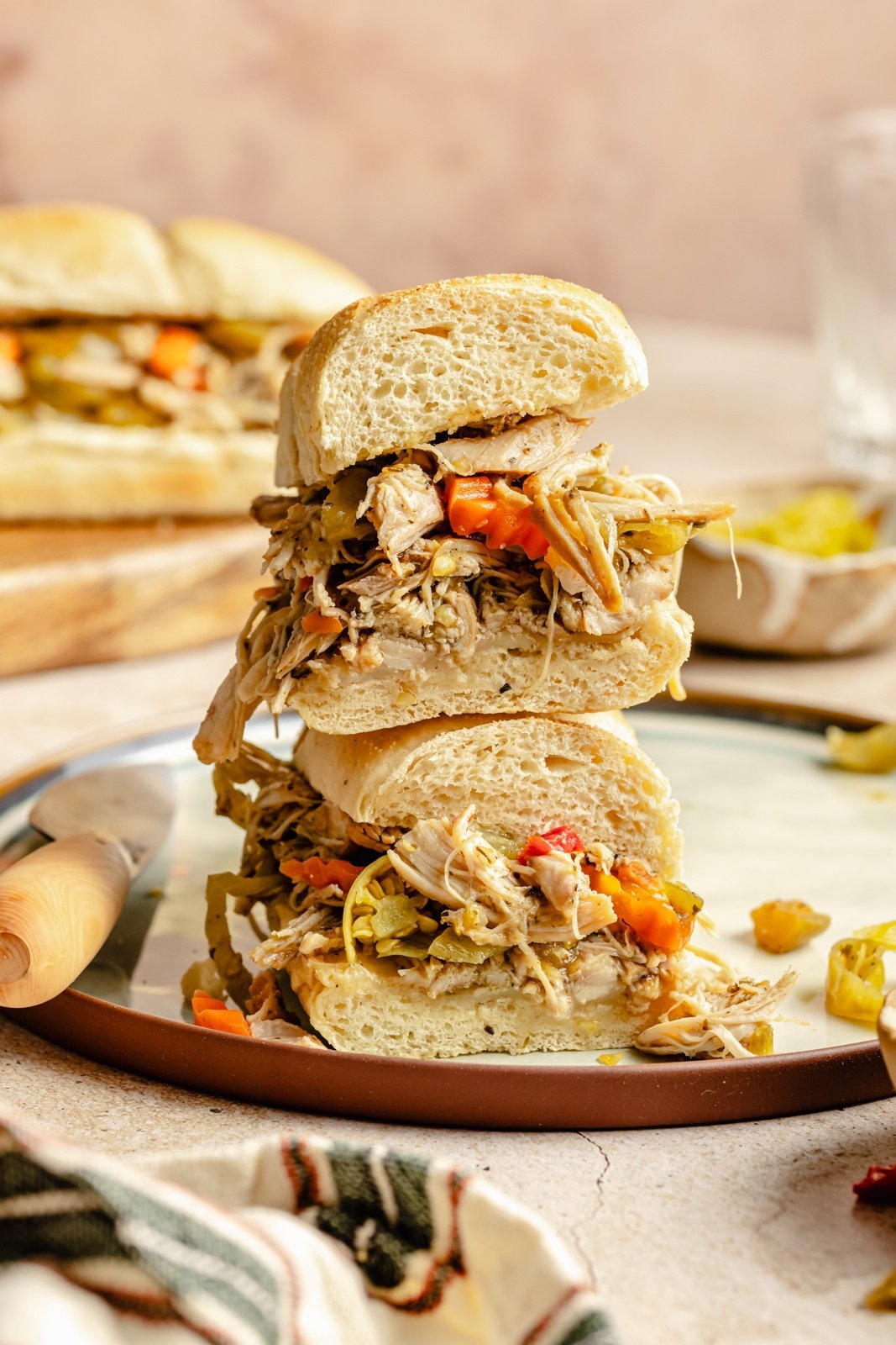 two halves of a slow cooker Italian chicken sandwich stacked