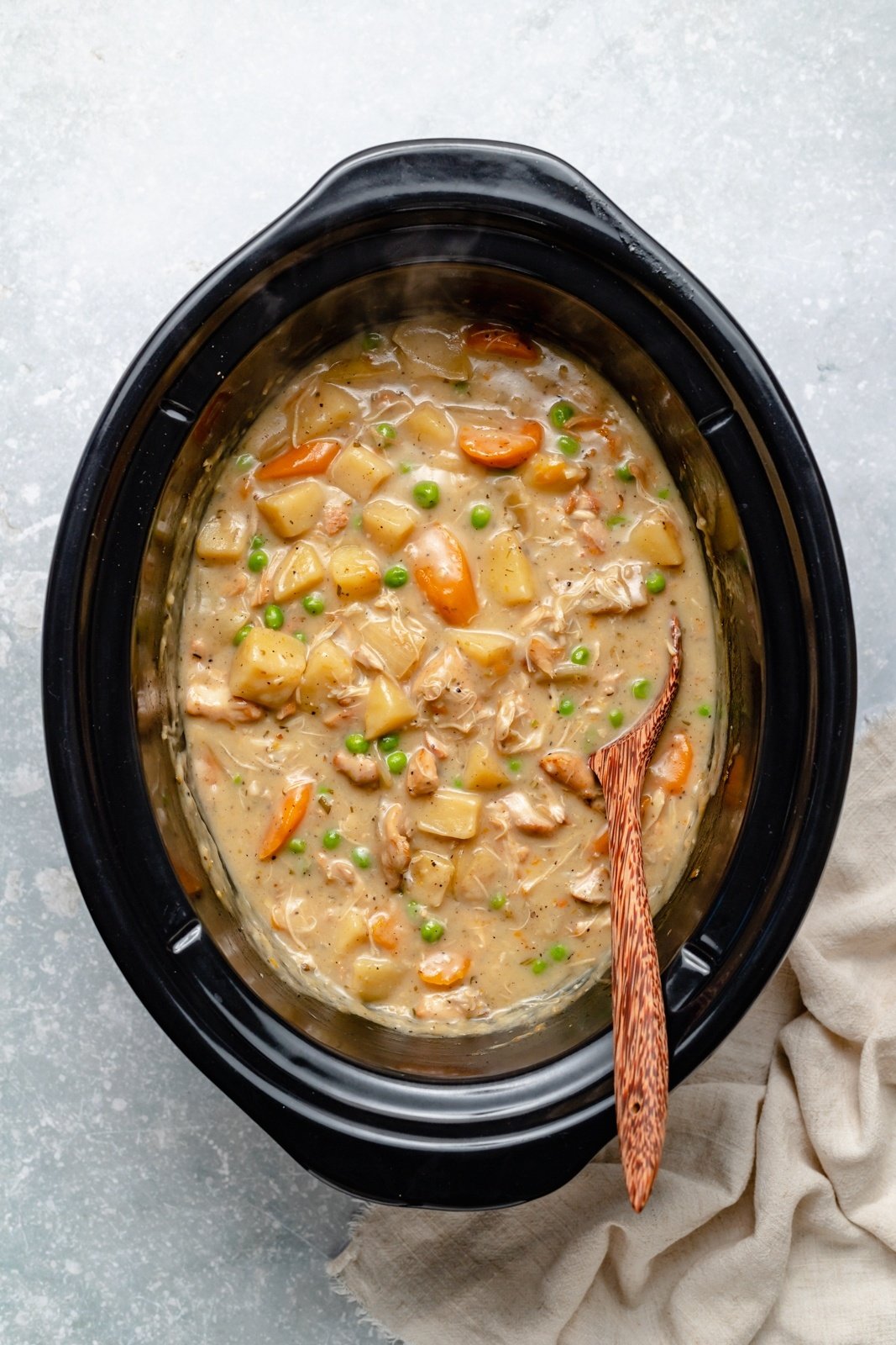 creamy white wine chicken stew in a crockpot