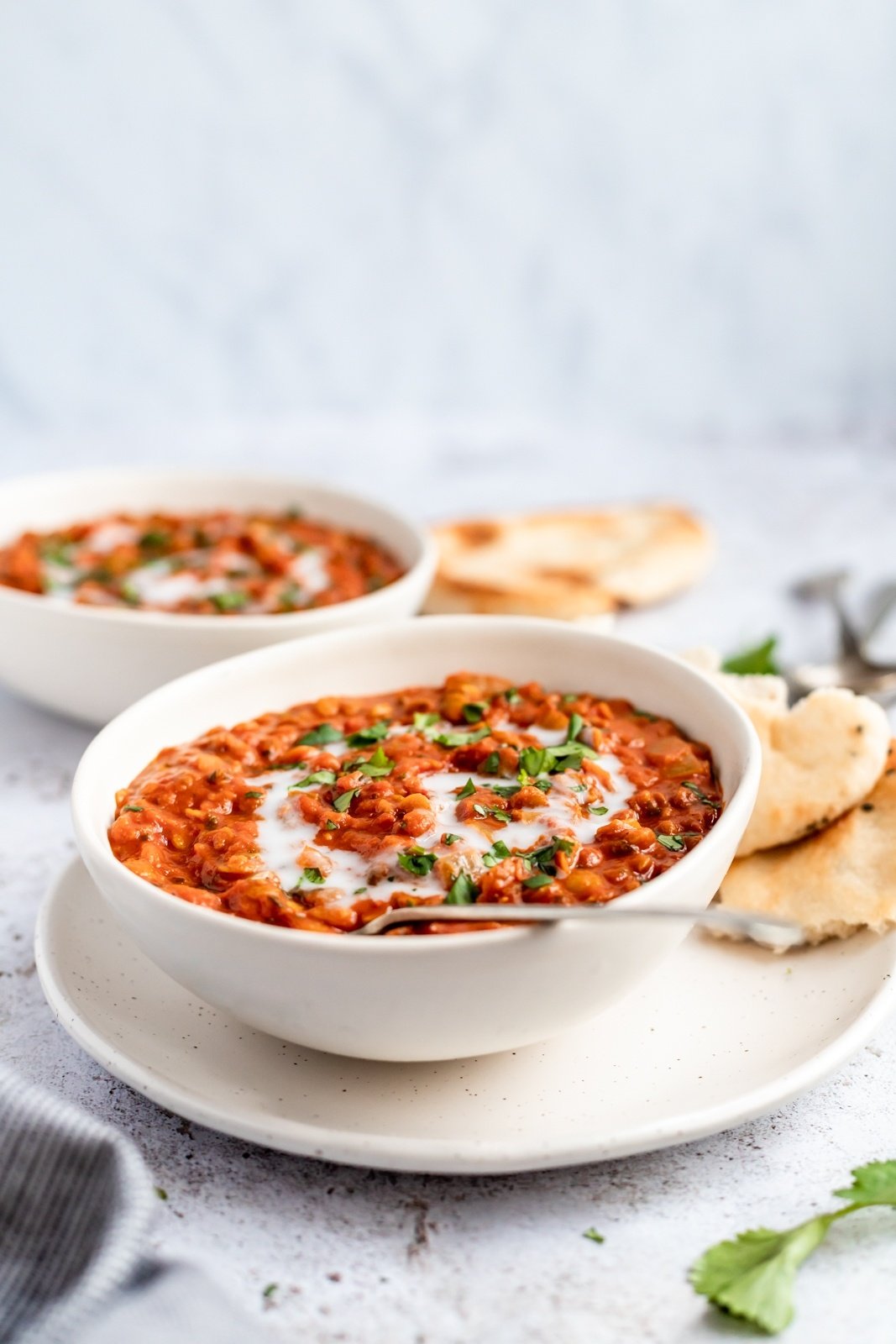 vegan coconut tomato lentil soup in a bowl